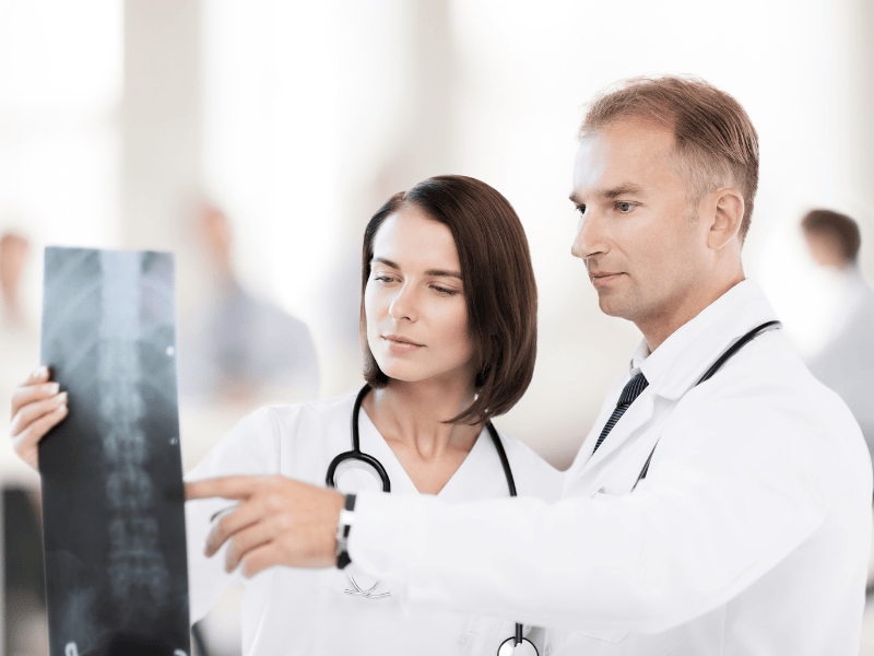 Orthopedic Surgeons Looking at Xray