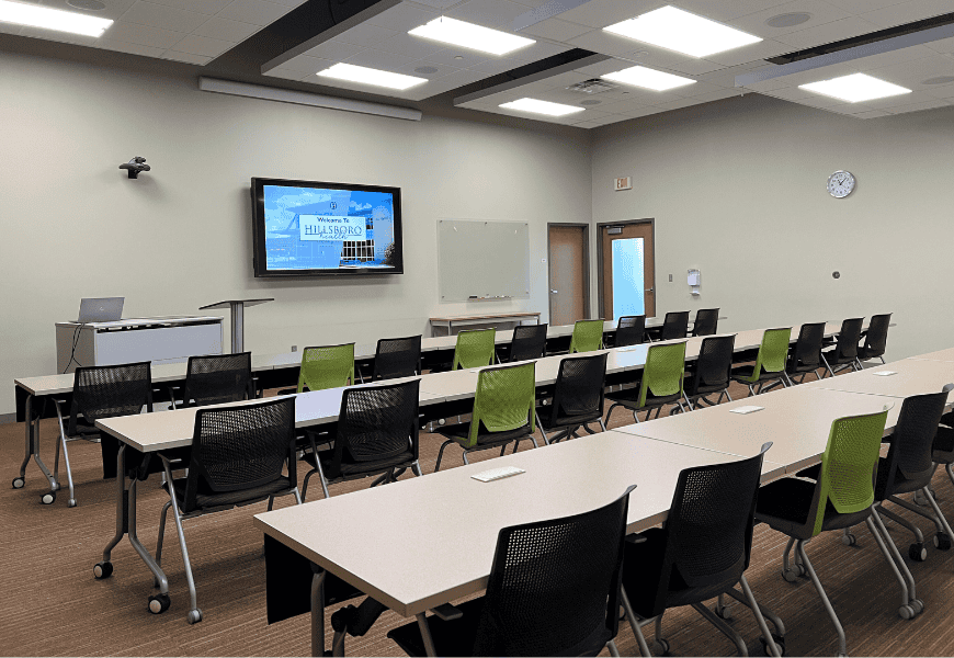 Photo of Cloud Room with tables, chairs monitors